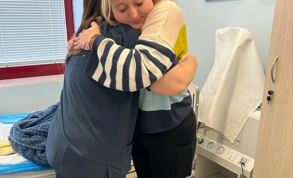 CRPS-Support Patient and caretaker hugging eachother in Italy after neridronate infusions