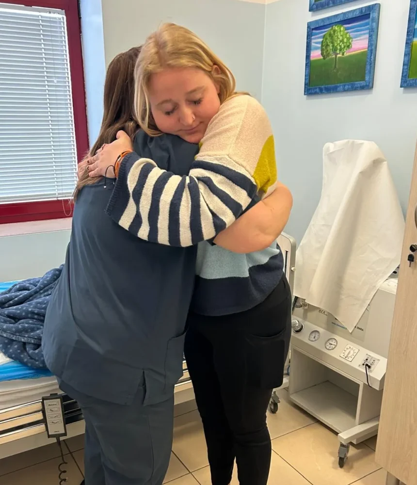 CRPS-Support Patient and caretaker hugging eachother in Italy after neridronate infusions
